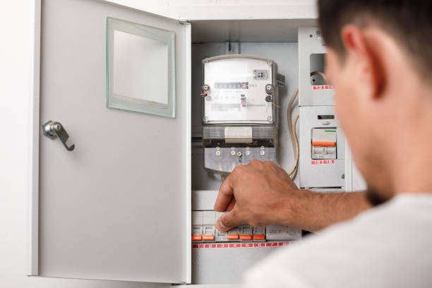Electrician working on a fuse board